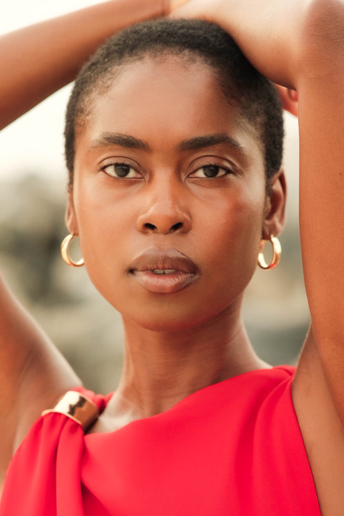 Close beauty portrait in a vivid red dress