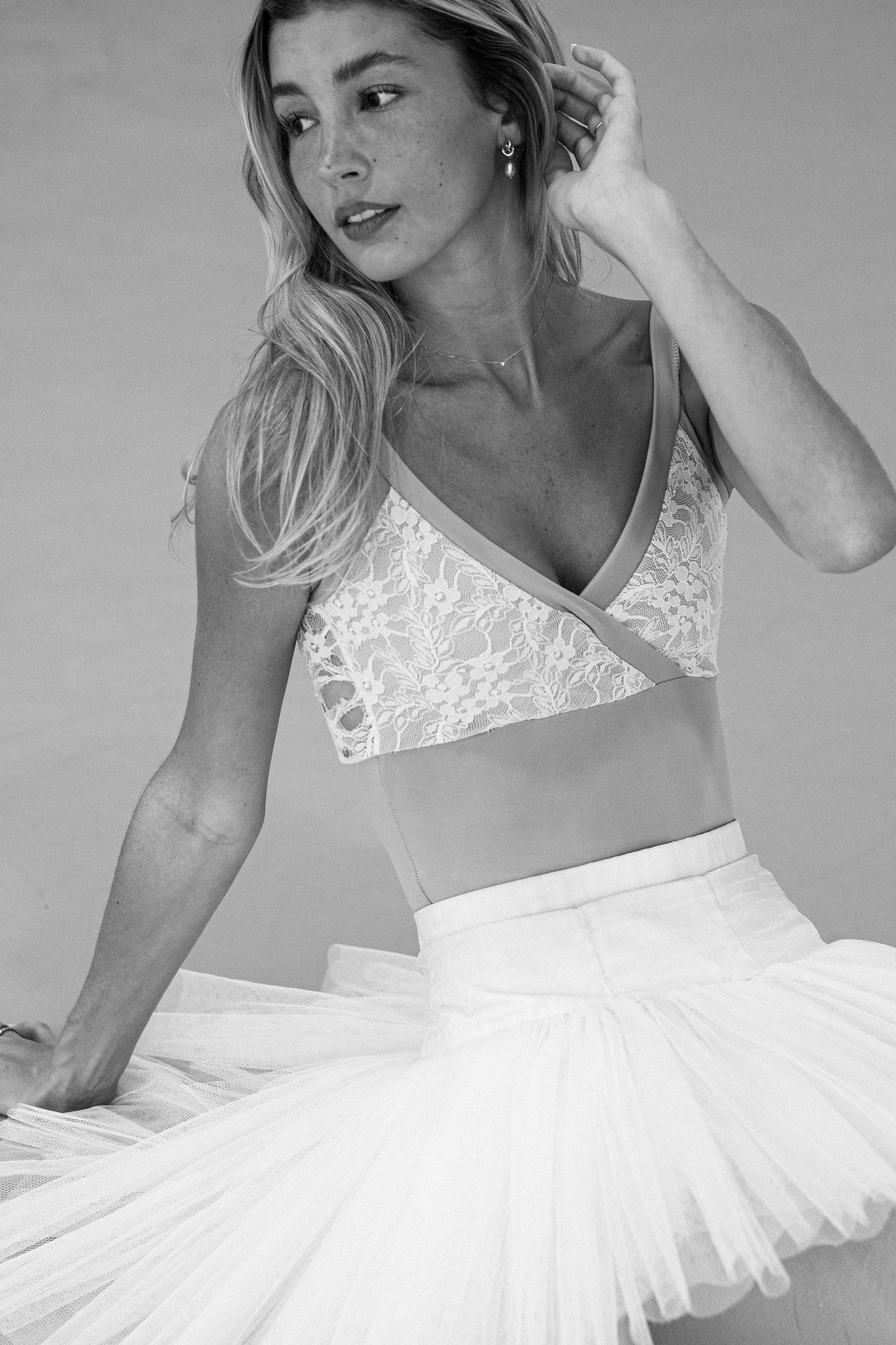 Black-and-white ballet portrait in a lace bodice and white tutu