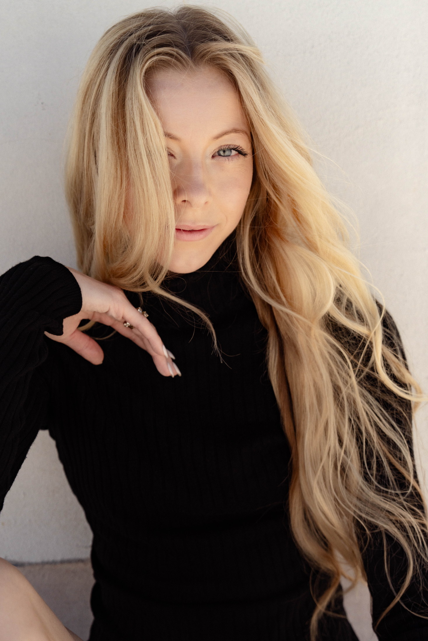Minimal portrait in black with long blonde hair
