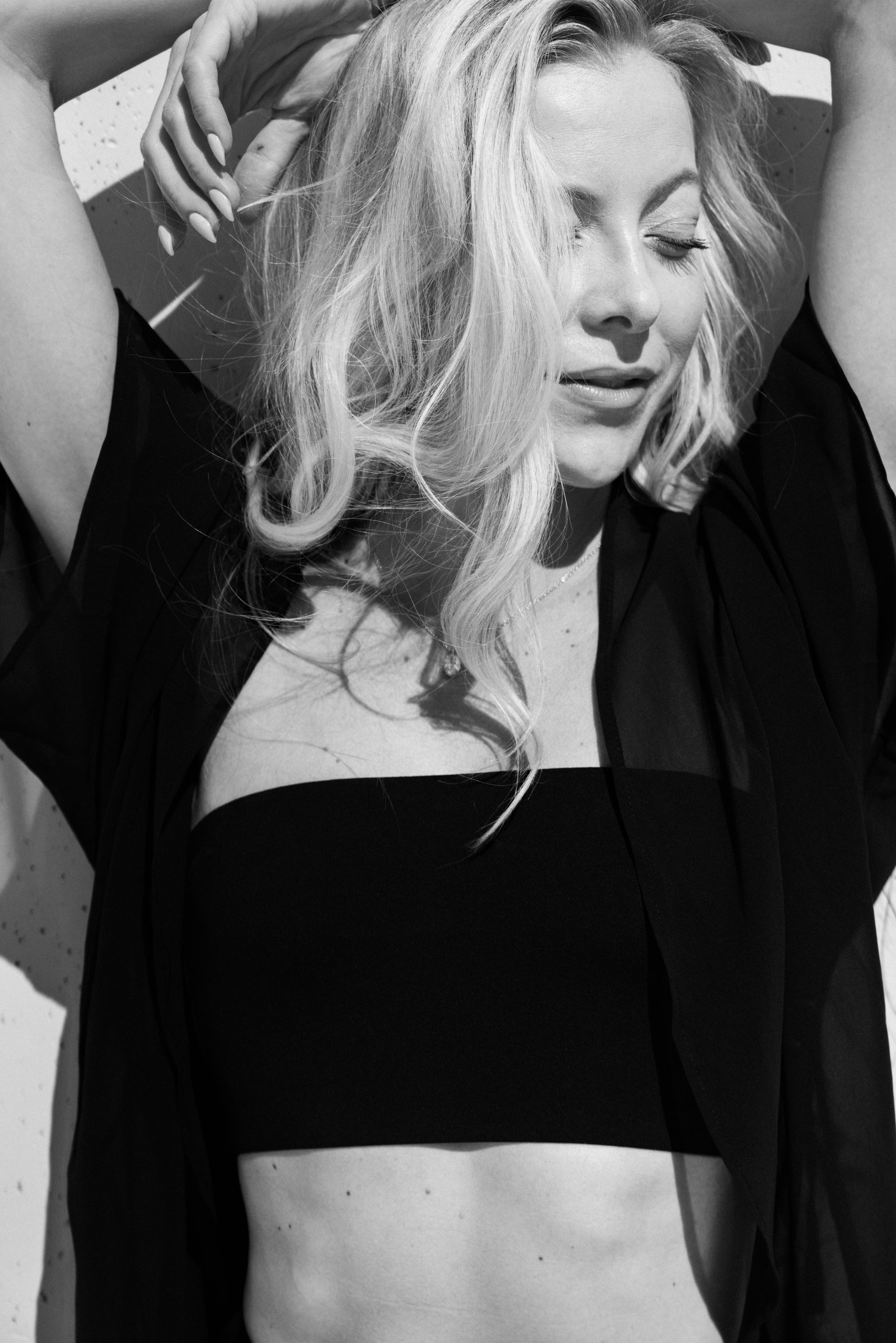 Intimate black-and-white portrait in a dark look